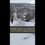 Parked police car creates domino effect as vehicles crash on icy Oregon road